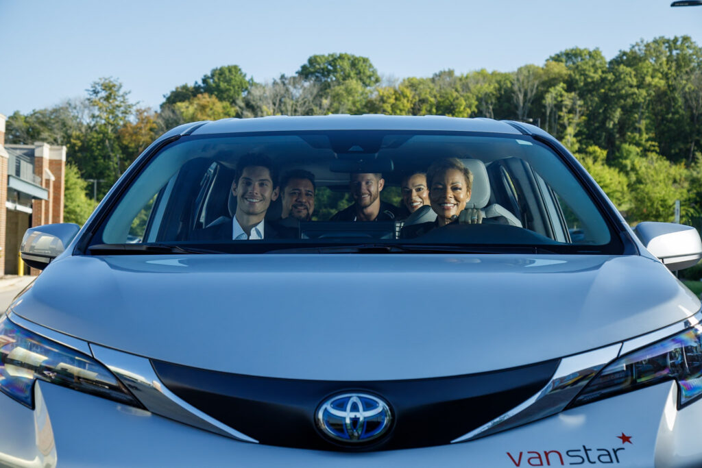 Front view of commuters in vanstar vehicle